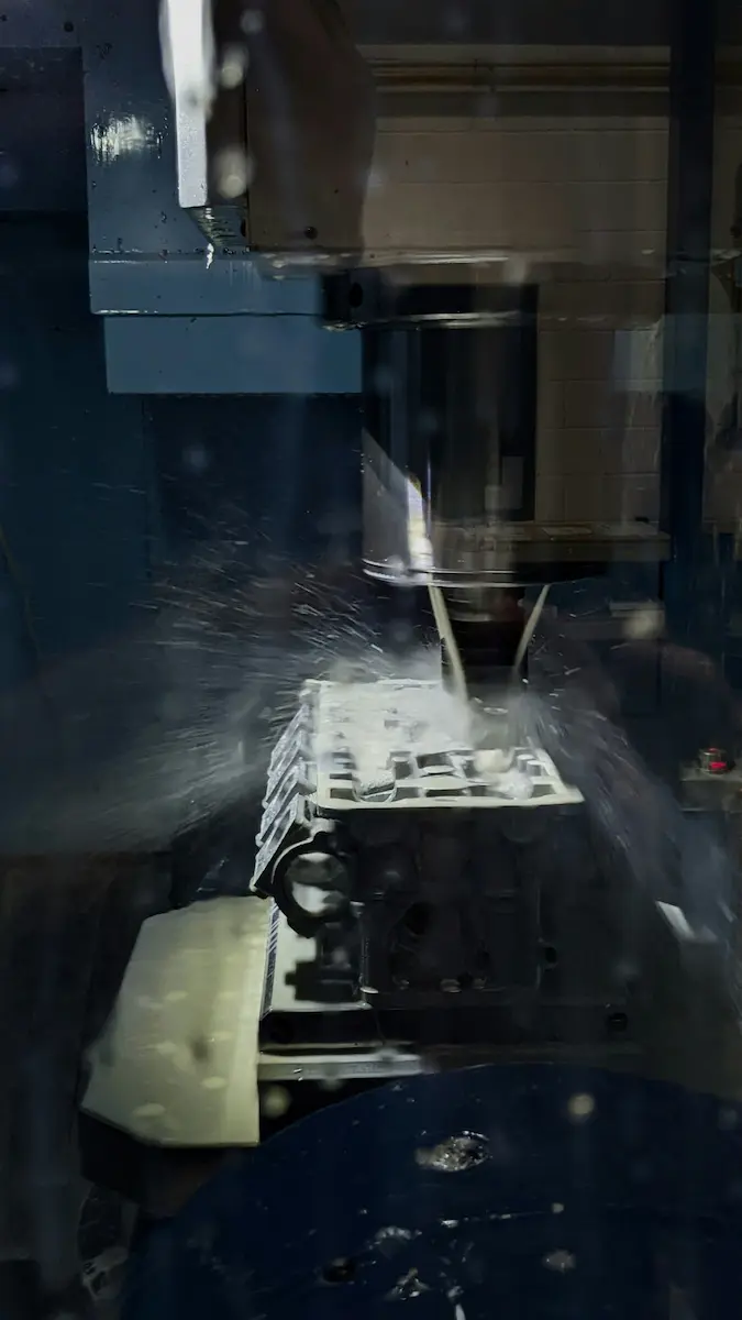 CNC machine precision cutting with rotary tooling in an industrial setting