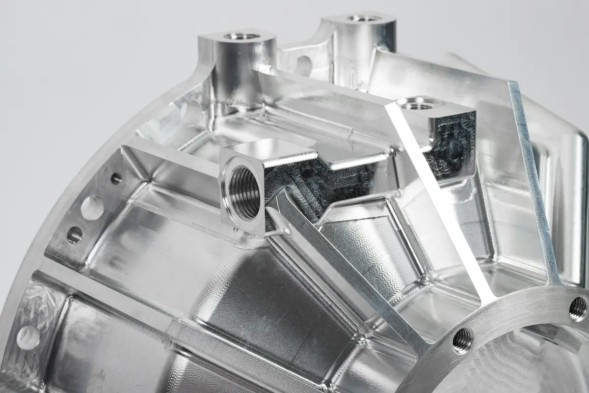 Complex curved aluminum housing with threaded inserts and precision-machined contours